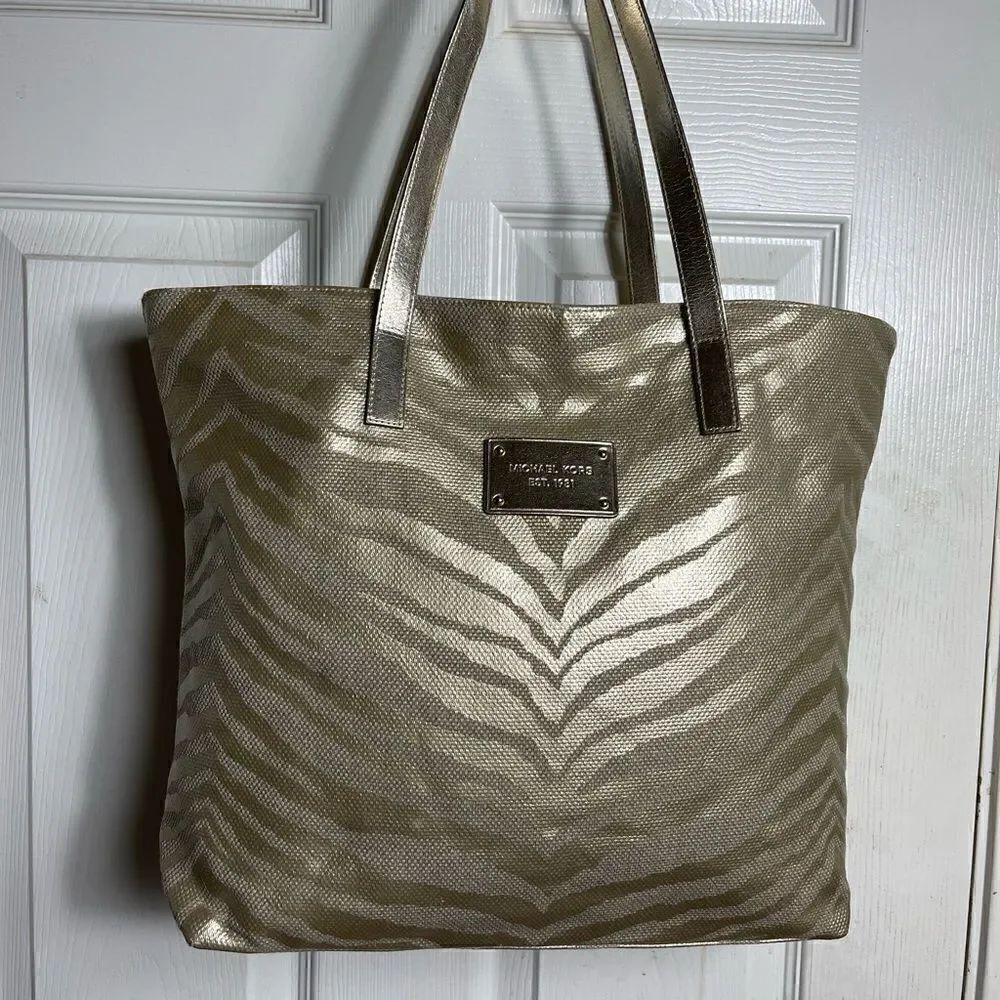 Michael Kors Metallic gold zebra print large tote gold tone hardwares and straps